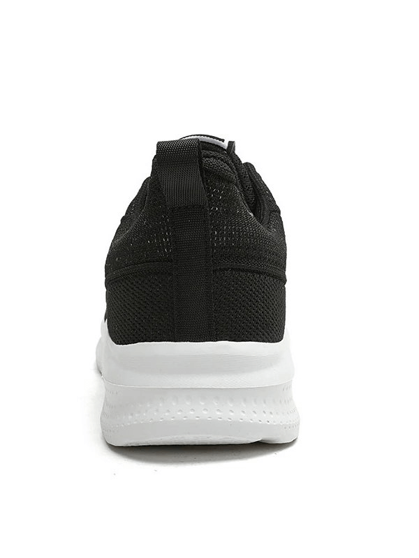 Rear view of black sports mesh breathable women's training shoe with EVA outsole.